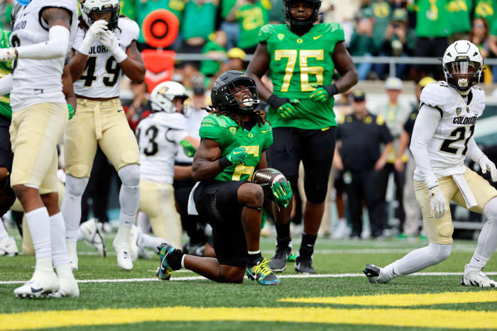 Oregon Ducks running back Noah Whittington celebrates after scoring a touchdown against the Colorado Buffaloes.